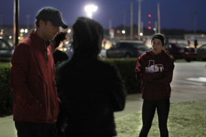 Ashley Flores, junior in sociology, listens as head track coach Koby Styles tells the team what drills to run on the teams last practice before leaving for the Indoor Track Championship in Lubbock Friday morning. Photo by Lauren Roberts
