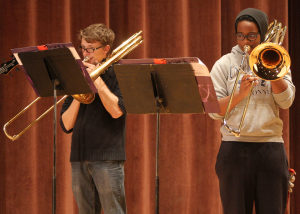 Austin Glenn, music education freshman, and Makayla Scott, music education freshman, practice at The Bone Yard Jazz Trombone Ensemble rehearsal for An Evening of Jazz and Pop Music Tuesday afternoon. The performance was in Akin Auditorium Nov. 18. Makayla Scott, music education freshman, said, "If you want to hear rock and jazz performed for free come and listen." Photo by Lauren Roberts