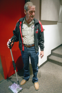 Robert Entrekin, custodian, talks with a news reporter while he vacuums a lecture room in the C wing of the Fain Fine Arts building, Monday, April 27, 2015. "i don't see it being a plus for the employees. We get an hour and a half 3 times a week in the wellness center, we get our birthdays off, and we have 15 days. You can bet your lucky dime that all that's gone if we sign with the private company. I can't see the employees benefit from all this, but we are the last ones to be considered," says Entrekin. Photo by Rachel Johnson