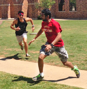 Danny Le, nursing sophomore and the "O-Z" zombie, chases Thomas Mammen, biology pre-med freshman, as part of the Humans vs. Zombies game. Photo by Avery Whaite.