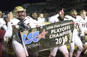 Derek Lockhart, sports and leisure senior, walks along the field with Brandon Gordon, education senior, and the team after winning the Lone Star Conference Championship, beating Texas A&M – Commerce 37-33 Nov. 14. Photo by Francisco Martinez