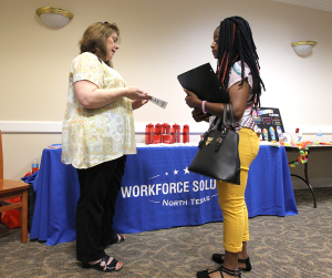 ShaDera Williams, athletic training freshman, talks to a Workforce Solutions representative at the Part-Time Networking Job Fair Sept. 7, 2016. Photo by Izziel Latour.