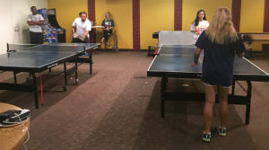 Back right: Nicole Leung, marketing senior, plays in the table tennis tournament on Sept. 8. Photo by Sam Sutton
