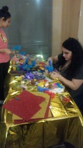 students decorate their masks at UPB Mardi Gras event