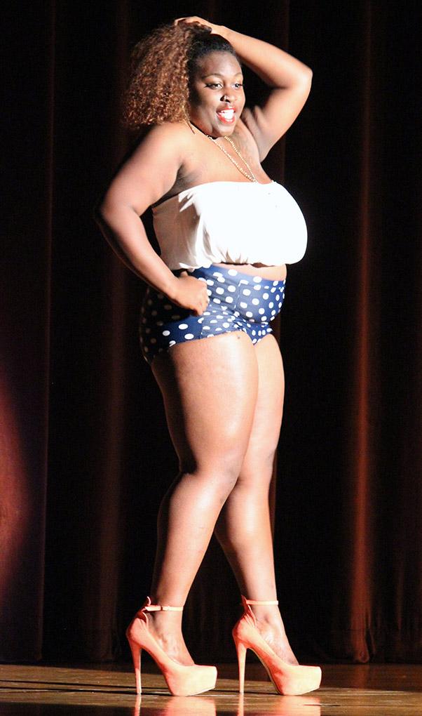 Debossha Christian, mechanical engineering soph, poses during the swimsuit round during the Caribfest Pageant Wednesday night in Akin Auditorium. Pageant started 45 minutes late, but the house was still packed with more than 300 people for the show. Five contestants competed in the Miss Caribfest Pageant, with Indira Placide winning the crown. Photo by Rachel Johnson