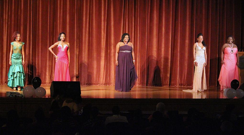 The five contestants wait patiently to be awarded prizes and find out who the winner is during the Caribfest Pageant Wednesday night in Akin Auditorium. Pageant started 45 minutes late, but the house was still packed with more than 300 people for the show. Five contestants competed in the Miss Caribfest Pageant, with Indira Placide winning the crown. Photo by Rachel Johnson