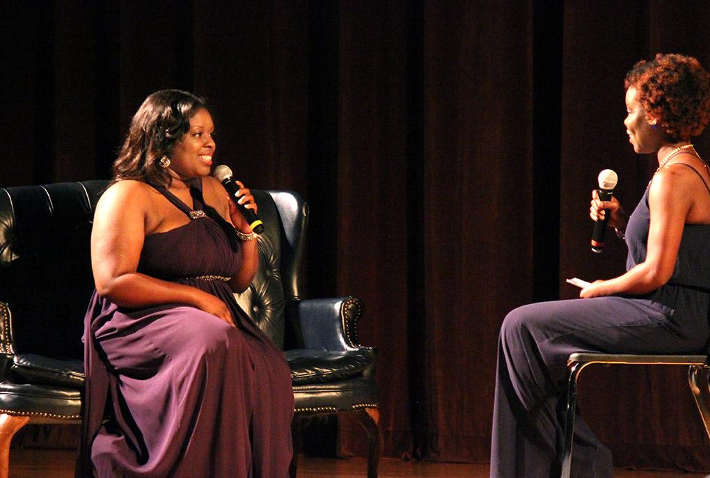 Valencia Morris, nursing junior, answers questions in the interview portion during the Caribfest Pageant Wednesday night in Akin Auditorium. Pageant started 45 minutes late, but the house was still packed with more than 300 people for the show. Five contestants competed in the Miss Caribfest Pageant, with Indira Placide winning the crown. Photo by Rachel Johnson