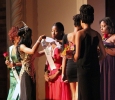 Indira Placide, biology junior, is presented with her sash and crown as she is annouced as the Miss Caribfest 2014 during the Caribfest Pageant Wednesday night in Akin Auditorium. Pageant started 45 minutes late, but the house was still packed with more than 300 people for the show. Five contestants competed in the Miss Caribfest Pageant, with Indira Placide winning the crown. Photo by Rachel Johnson