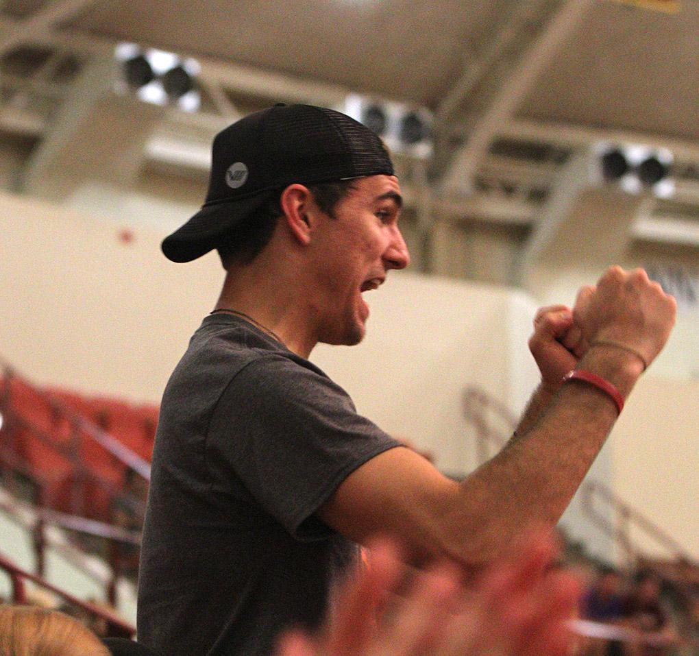 Ian Thompson, sophomore in mass communication, cheers at Convocation Tuesday evening. Photo by Lauren Roberts