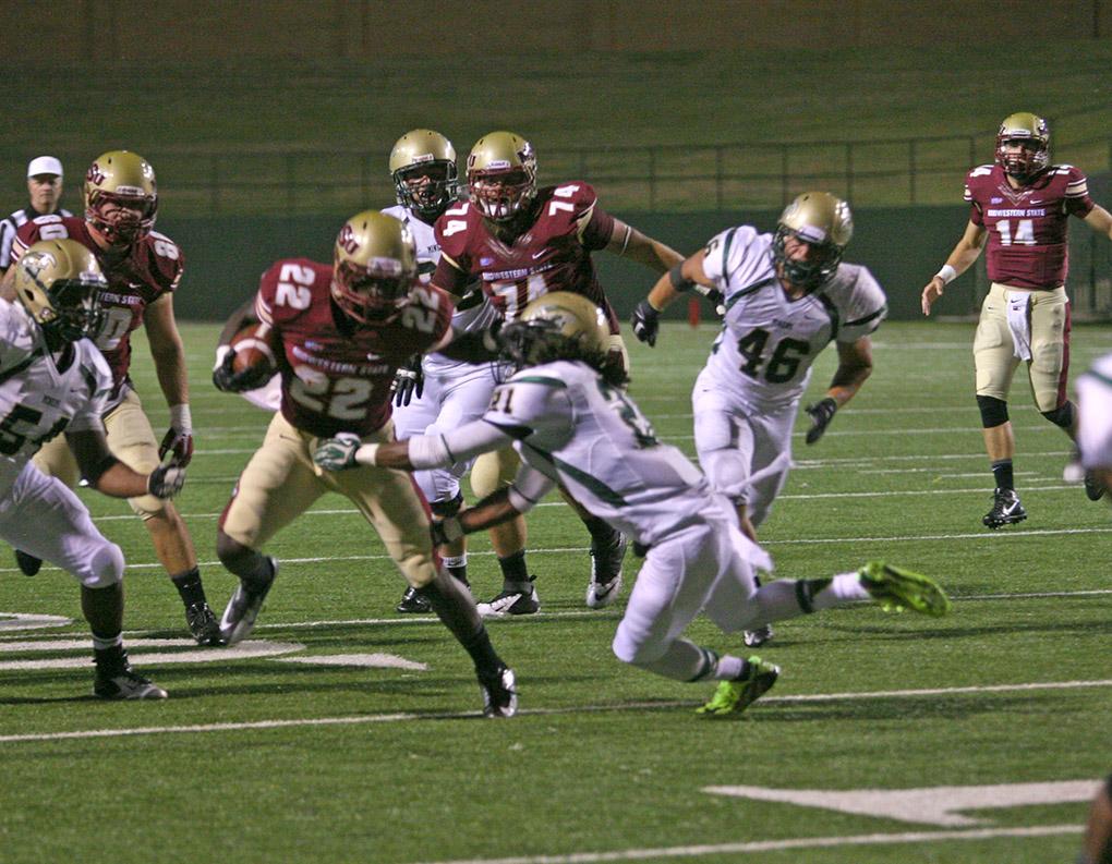 Freshman Don Jerry shakes off a double tackle. Midwestern State University ends the season opener against Missouri University of Science and Technology with a win of 40-23 at Memorial Stadium Saturday night. Photo by Shairi Stanley