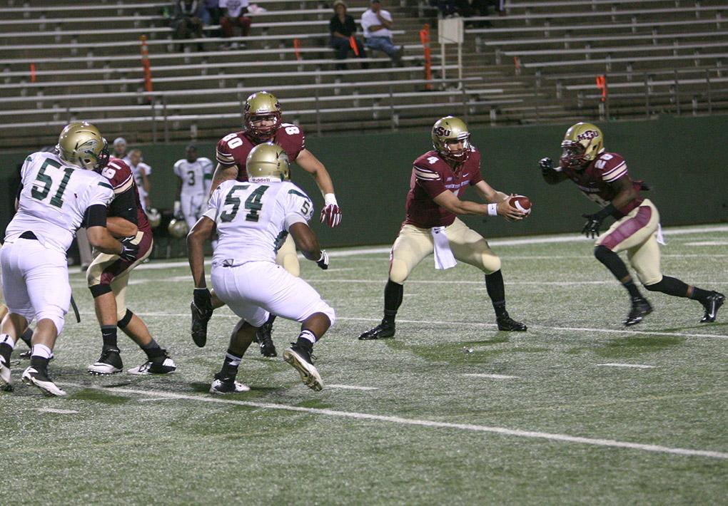 Senior Jake Glover hands off a sneaky pass to Sophomore Kinesology major, Dante Taylor.Midwestern State University ends the season opener against Missouri University of Science and Technology with a win of 40-23 at Memorial Stadium Saturday night. Photo by Shairi Stanley