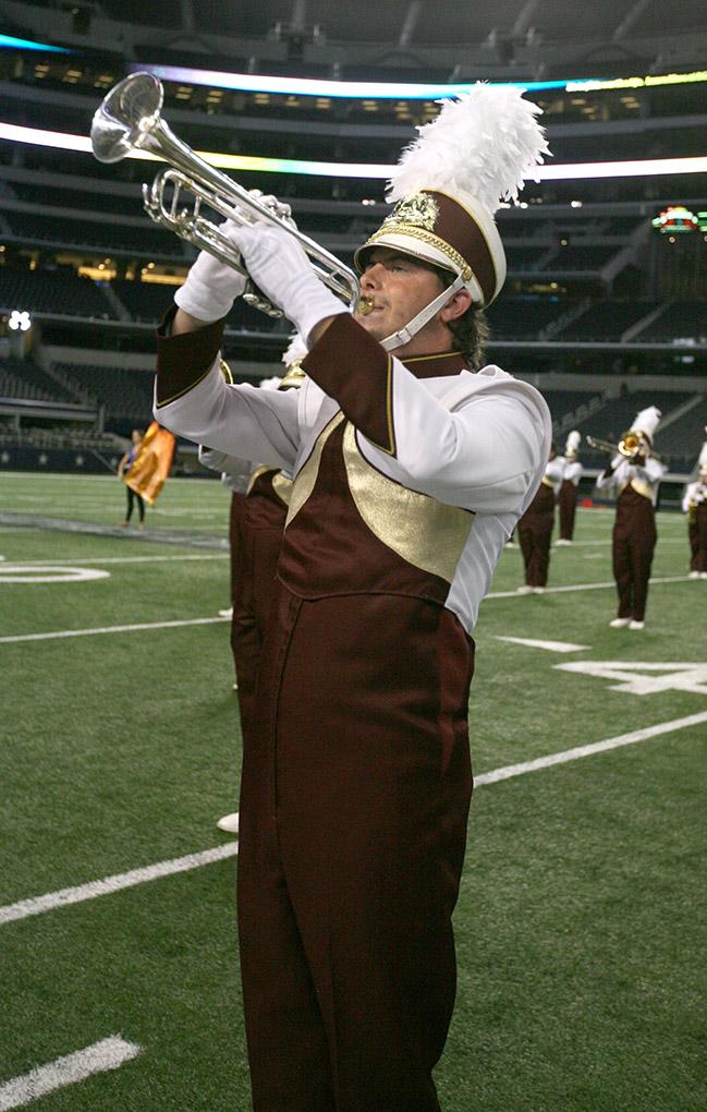 Hoss Barnes, music education junior, marches with the band at halftime at Midwestern State University v. Eastern New Mexico game at AT&T Cowboys Stadium in Arlington, Sept. 20, 2014. Photo by Rachel Johnson