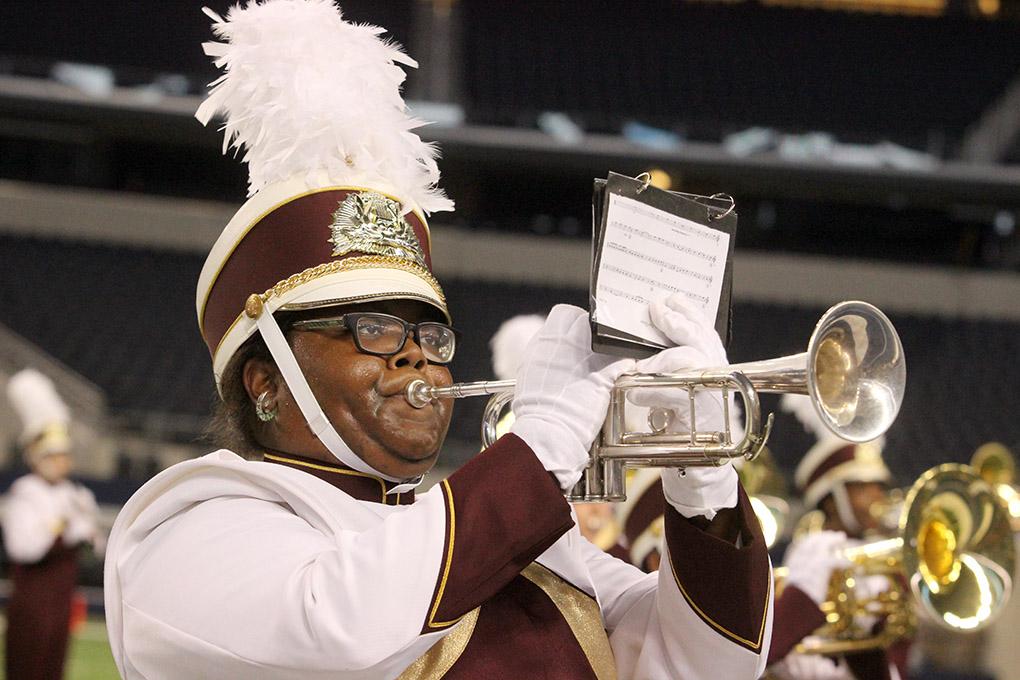 Cierra Phillips, physcology sophomore, marches with the band during halftime at Midwestern State University v. Eastern New Mexico game at AT&T Cowboys Stadium in Arlington, Sept. 20, 2014. Photo by Rachel Johnson