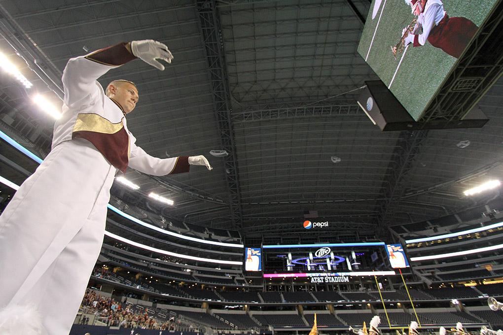 Joe Clever, history senior, directs the band at halftime during the Midwestern State University v. Eastern New Mexico game at AT&T Cowboys Stadium in Arlington, Sept. 20, 2014. Photo by Lauren Roberts