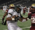 Eastern New Mexico running back Jordan Wells is run out of bounds by Midestern State University's Herb Whitehurst, kinesiology junior, at Midwestern State University v. Eastern New Mexico game at AT&T Cowboys Stadium in Arlington, Sept. 20, 2014. Photo by Lauren Roberts