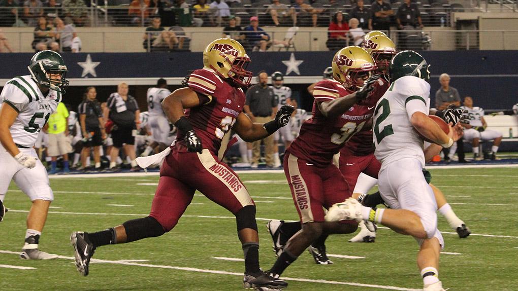 Malachi Smith, undecided freshman, tackles Eastern New Mexico's Ryan Greene at the  Midwestern State University v. Eastern New Mexico game at AT&T Cowboys Stadium in Arlington, Sept. 20, 2014. Photo by Rachel Johnson