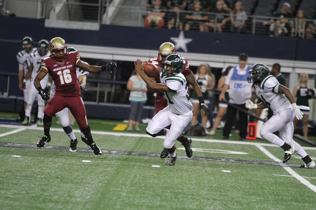 Eastern New Mexico running back Kamal Cass runs the ball at Midwestern State University v. Eastern New Mexico game at AT&T Cowboys Stadium in Arlington, Sept. 20, 2014. Photo by Lauren Roberts