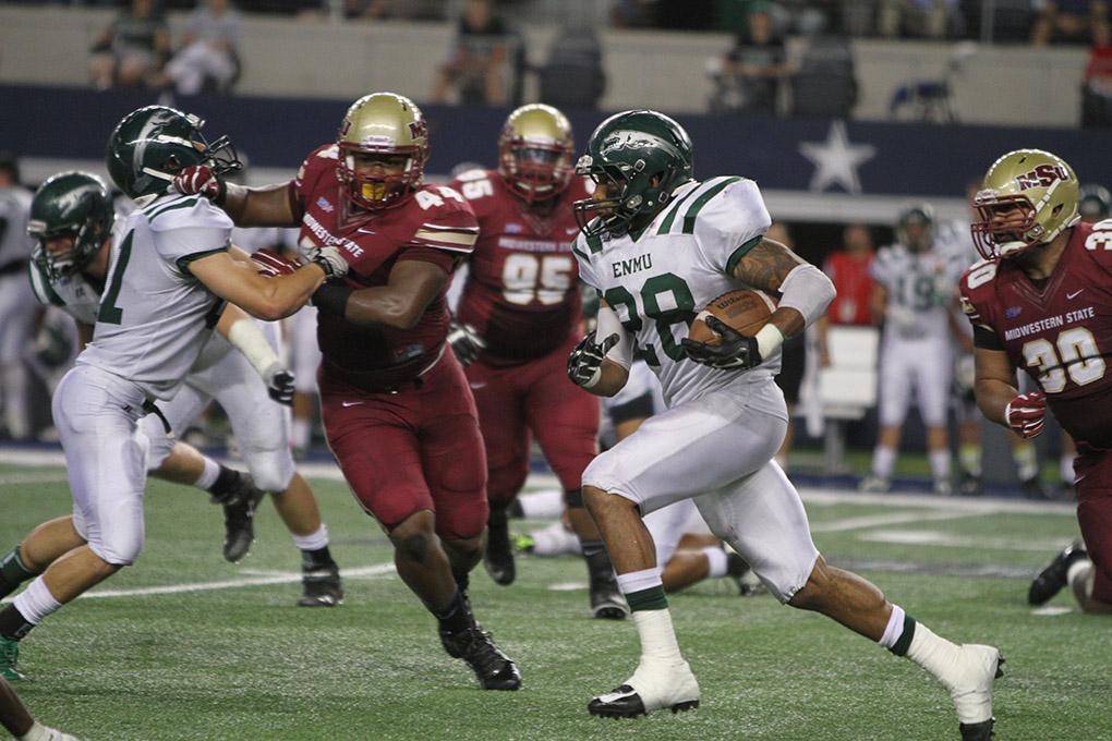 Eastern New Mexico Jordan Wells runs the ball at Midwestern State University v. Eastern New Mexico game at AT&T Cowboys Stadium in Arlington, Sept. 20, 2014. Photo by Lauren Roberts