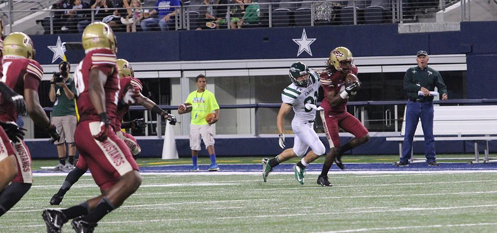 Dominique Rouse, business junior, runs his interception back for the first idwestern State University touchdown at MSU v. Eastern New Mexico game at AT&T Cowboys Stadium in Arlington, Sept. 20, 2014. Photo by Rachel Johnson