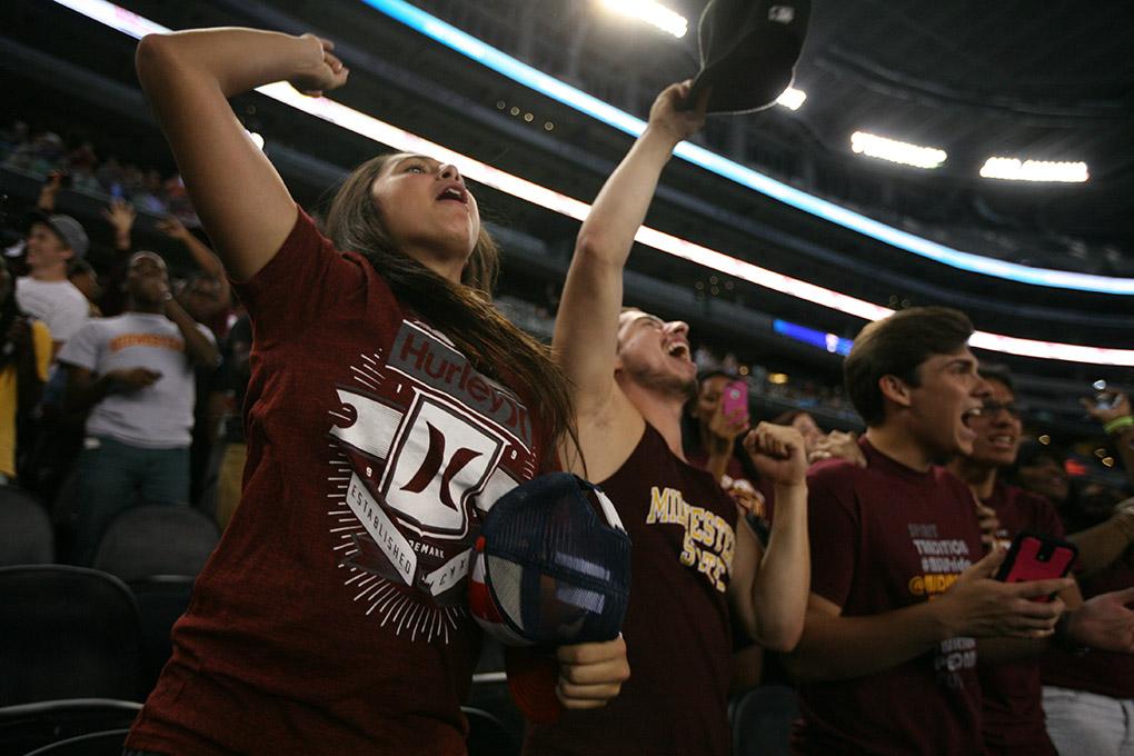 Malaeni Ramos, biology freshman, Tim Torres, biology freshman, Ben Massey, biology freshman, and Rodrigo Mireles, marketing freshman, getting excited after Midwesten scored a touch down. Midwestern State University v. Eastern New Mexico game at AT&T Cowboys Stadium in Arlington, Sept. 20, 2014. Photo by Rachel Johnson