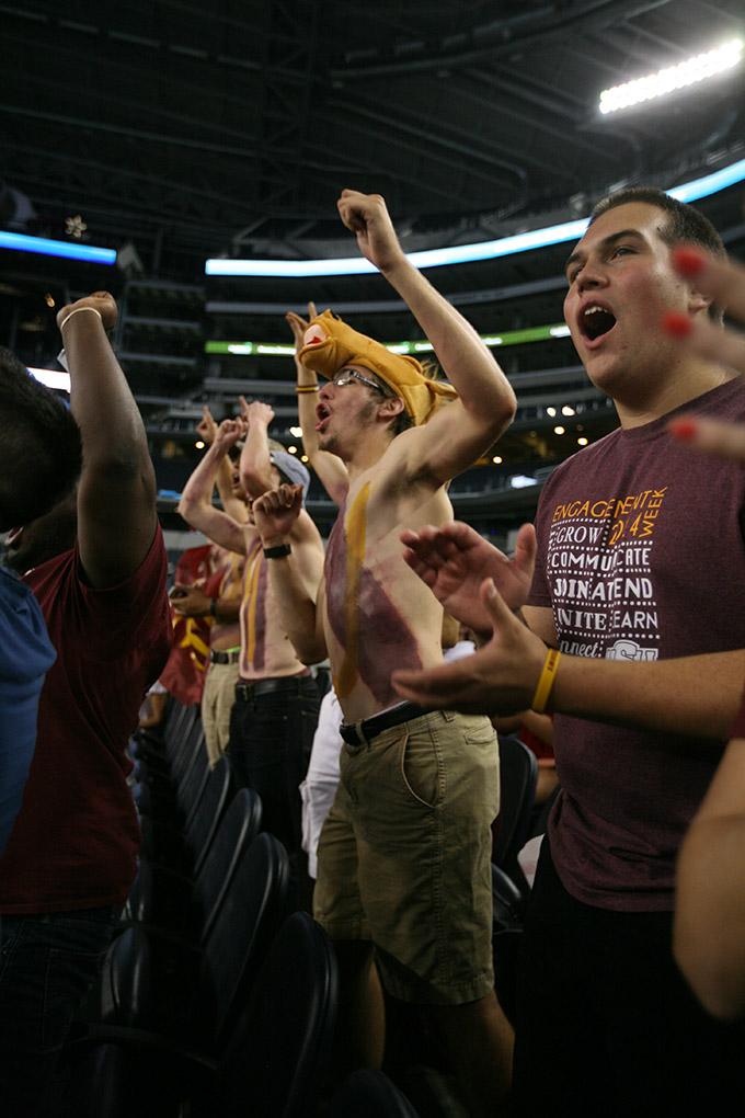 Brandon Allen, mechanical engineering sophomore, cheers with members of the stang gang at Midwestern State University v. Eastern New Mexico game at AT&T Cowboys Stadium in Arlington, Sept. 20, 2014. Photo by Rachel Johnson