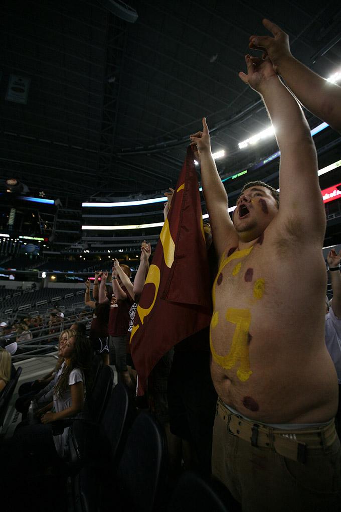 Micah Whitworth, criminal justice freshman, cheers with the stang gang at Midwestern State University v. Eastern New Mexico game at AT&T Cowboys Stadium in Arlington, Sept. 20, 2014. Photo by Rachel Johnson