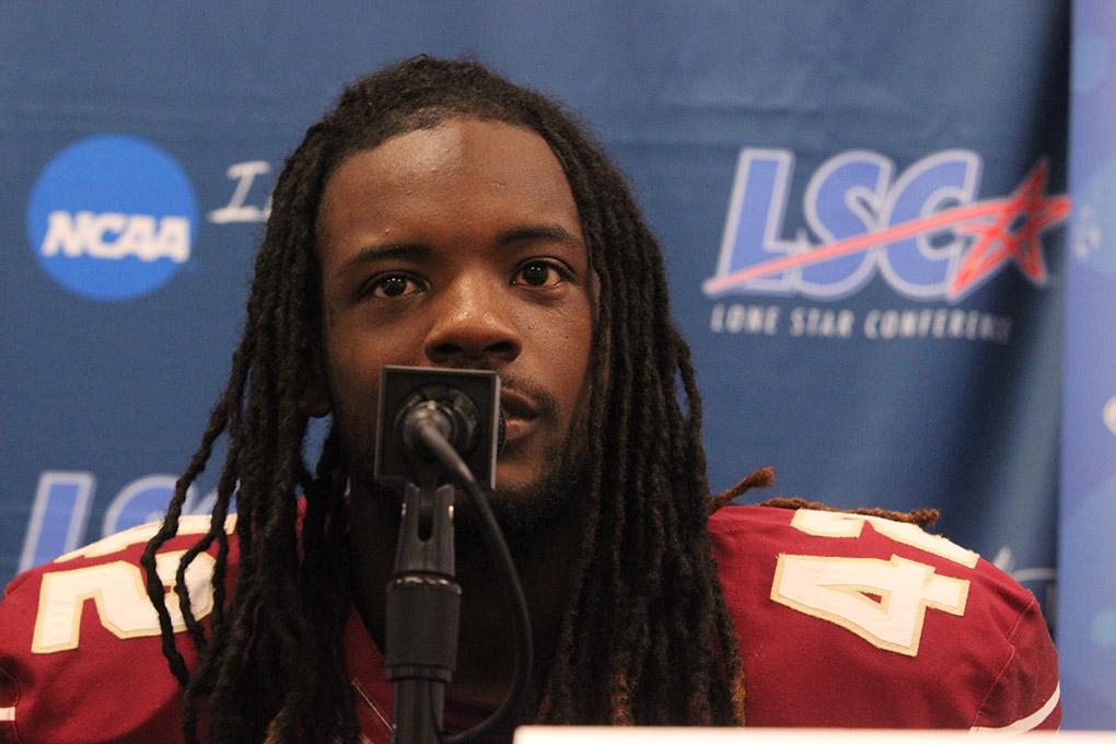 Dominique Rouse, business junior, answers questions from reporters about his first Midwestern State University career play where he scored the first MSU touchdown on an interception at MSU v. Eastern New Mexico game at AT&T Cowboys Stadium in Arlington, Sept. 20, 2014. Photo by Rachel Johnson
