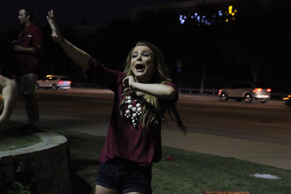 Destiny Zynda, excercise physiology sophomore, playing trashketball at the tailgating outside during the Midwestern State University v. Eastern New Mexico game at AT&T Cowboys Stadium in Arlington, Sept. 20, 2014. Photo by Rachel Johnson