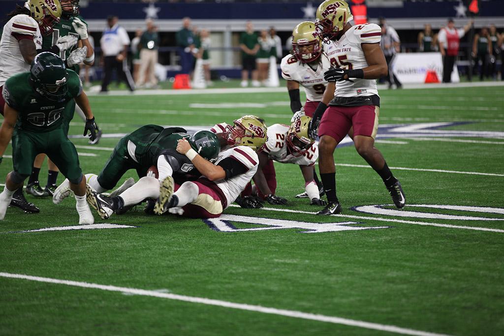 Daniel Laudemilk, history, tackles an opponent from Eastern New Mexico University at AT&T Stadium, Sept. 19. MSU beat ENMU 28-24. Photo by Francisco Martinez