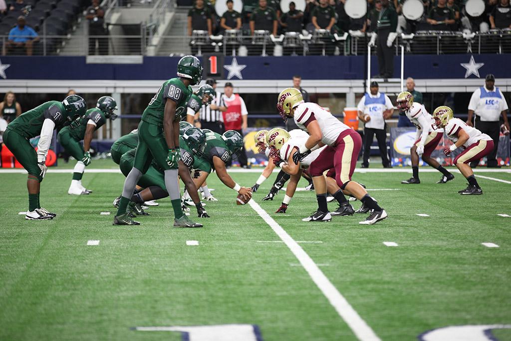 Midwestern State's defense lines up against Eastern New Mexico University in the first half of the game in AT&T Stadium, Sept. 19. Photo by Francisco Martinez