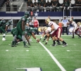 Midwestern State's defense lines up against Eastern New Mexico University in the first half of the game in AT&T Stadium, Sept. 19. Photo by Francisco Martinez
