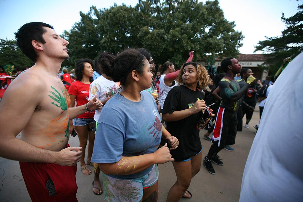 Jake West, radiology sophomore, dances with other participants at the 2015 CaribFest Parade, Sept. 25, Photo by Bradley Wilson