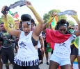 Iesha O'loughlin, accounting junior, and Shenice Walters, biology junior, dance as the 2015 CaribFest Parade goes down Council Dr. towards Comanche Trail, Sept. 25. Photo by Rachel Johnson
