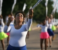 Theona Honore, continuing nursing student, leads the rest of the flag wavers during the 2015 CaribFest Parade, Sept. 25. Photo by Bradley Wilson