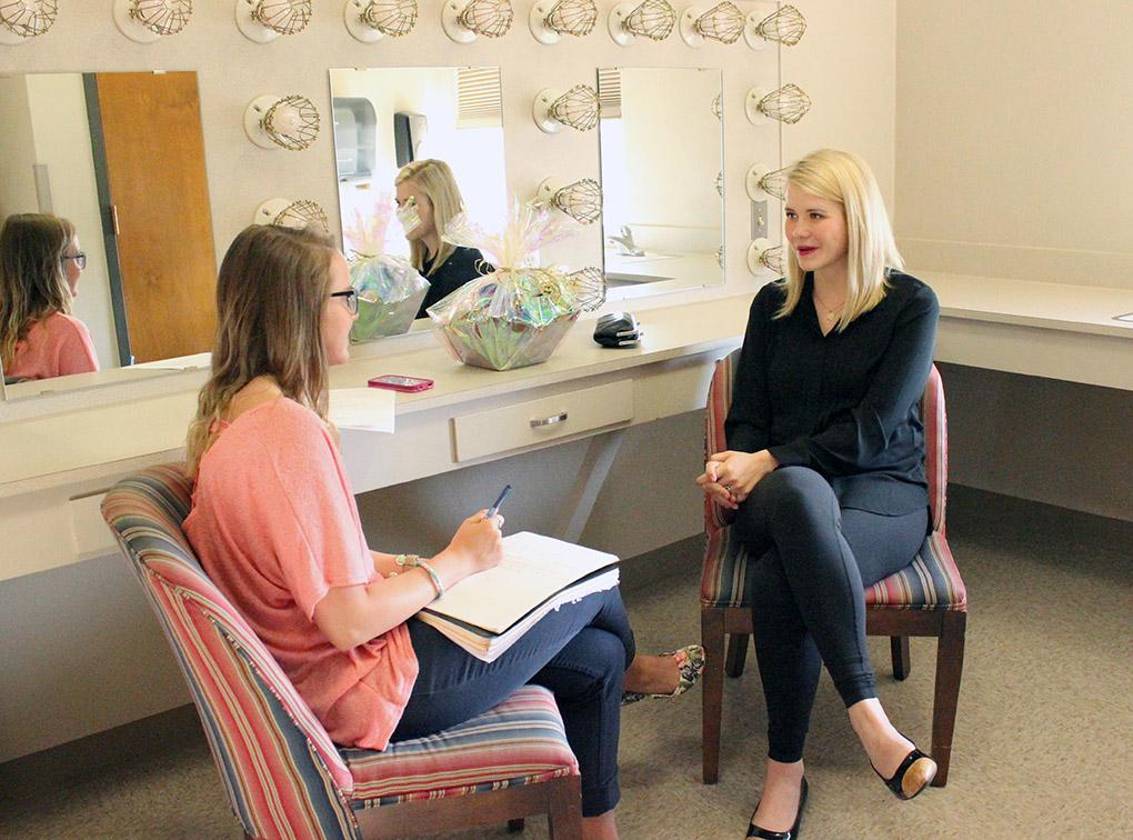 Morgan Haire, mass communication sophomore, interviews Elizabeth Smart before her going on, backstage in the dressing room, about her goals that she hopes to attain by speaking tonight at the lecture series. Smart speaks at her artist lecture series about her story of being kidnapped and the hardships she faced in the nine months she was held captive, until she was finally taken from her captives' custody and taken home. She was at the center of a nationally known child abduction case in 2002, and now has an advocacy program for Crimes Against Children, which eventually merged with the Operation Underground Railroad. Their was a full house in the Akin Auditorium for the last Artist-Lecture Series of this school year, Tues. April 21, 2015. Photo by Rachel Johnson