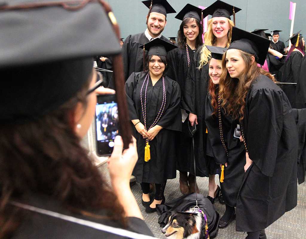 Graduates get a group photo together in the MPEC before Commencement Ceremony held in Kay Yeager Coliseum, Dec. 12. Photo by Rachel Johnson
