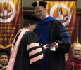 Susan Harvey, department chair and associate professor of music education, recieves the Faculty Award and was given the plaque by David Carlston, psychology professor, during the Commencement Cermony held in Kay Yeager Coliseum, Dec. 12. Photo by Rachel Johnson