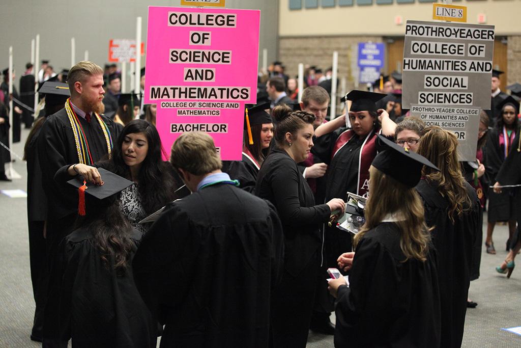 Graduate students are directed to their section at Midwestern State University graduation, May 16, 2015 at the Kay Yeager Coliseum. Photo by Francisco Martinez