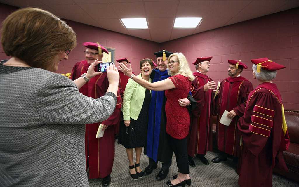 Julie Gaynor, director of marketing and public information, takes a picture of Retiring University President Jesse Rodgers with Cindy Ashlock, executive assistant to the President, and Ruth Ann Ray, assisstant to the President, in the green room before the ceremony at Midwestern State University graduation, May 16, 2015 at the Kay Yeager Coliseum. Photo by Rachel Johnson