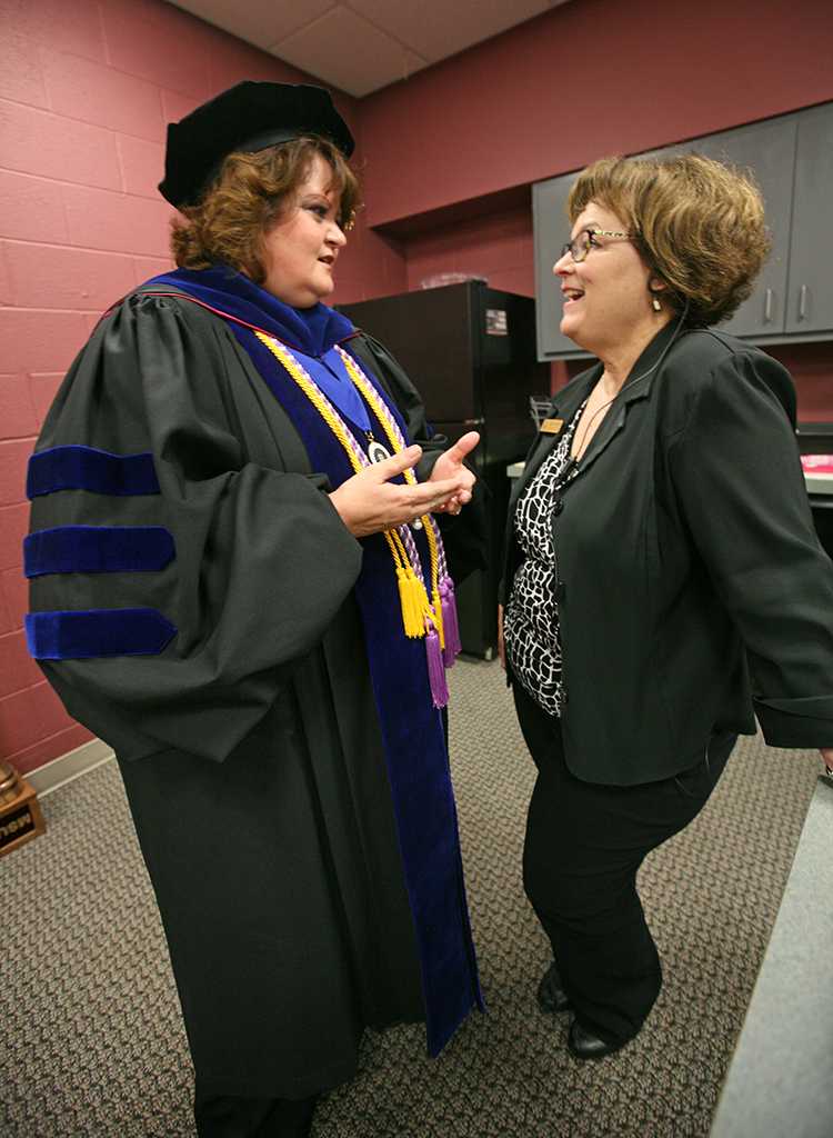 Deborah Garrison, vice president, talks with Debbie Barrow, director of board and government relations, in the green room before the ceremony at Midwestern State University graduation, May 16, 2015 at the Kay Yeager Coliseum. Photo by Rachel Johnson