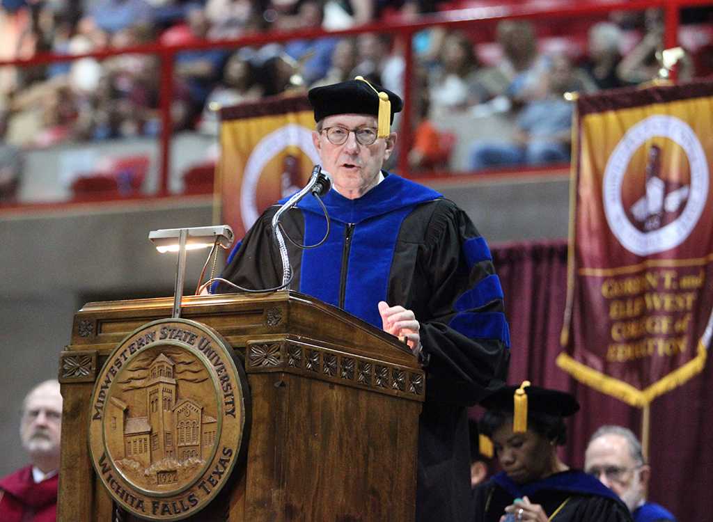 Retiring University President Jesse Rogers gives an opening speech into the ceremony at the Midwestern State University graduation, May 16, 2015 at the Kay Yeager Coliseum. Photo by Rachel Johnson