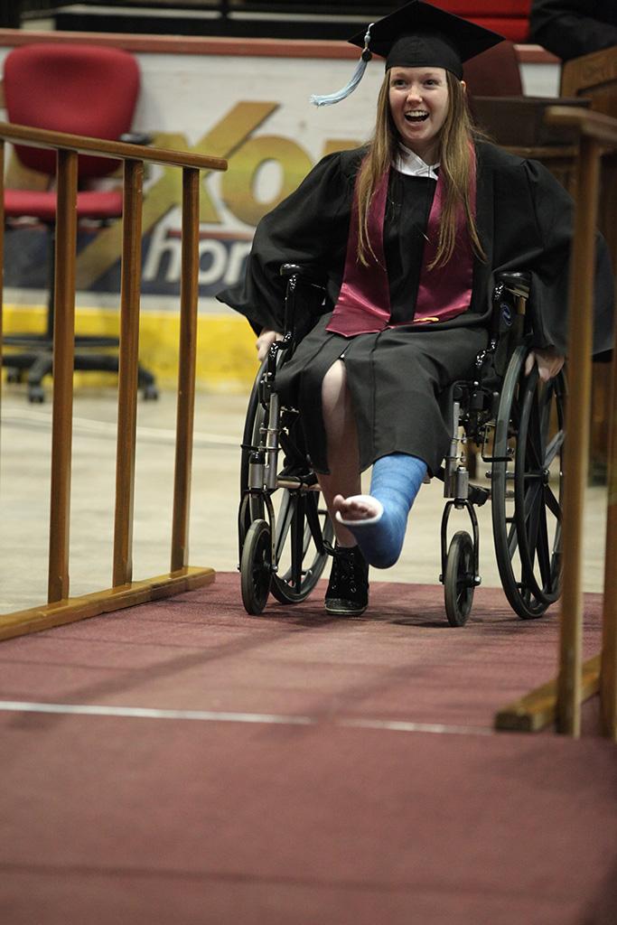 Meagan Shih, interdisciplinary studies senior, enters the stage after her name is called at Midwestern State University graduation, May 16, 2015 at the Kay Yeager Coliseum. Photo by Francisco Martinez