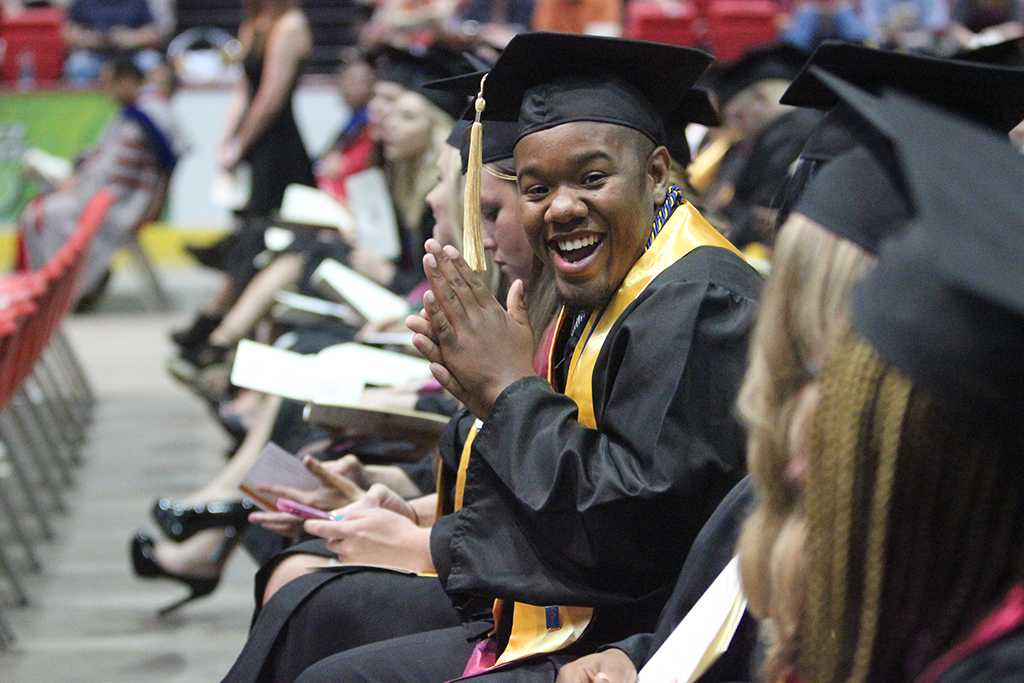 Jordan Branch, social work, gets excited as his row is about to be called up to go to the stage at Midwestern State University graduation, May 16, 2015 at the Kay Yeager Coliseum. Photo by Rachel Johnson