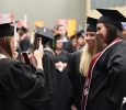 Michelle Sutton, English, takes a picture of Dusti Cribbs, English, and Taylor Baggett, English, at Midwestern State University graduation, May 16, 2015 at the Kay Yeager Coliseum. Photo by Francisco Martinez