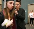 Kayla Brixey, registrar assistant, helps fix Emmily Ann Holub's, political science, gown before the ceremony at Midwestern State University graduation, May 16, 2015 at the Kay Yeager Coliseum. Photo by Rachel Johnson