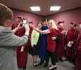 Julie Gaynor, director of marketing and public information, takes a picture of Retiring University President Jesse Rodgers with Cindy Ashlock, executive assistant to the President, and Ruth Ann Ray, assisstant to the President, in the green room before the ceremony at Midwestern State University graduation, May 16, 2015 at the Kay Yeager Coliseum. Photo by Rachel Johnson