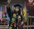 Andrea Carter, accounting, waves to the audience after receiving her diploma at Midwestern State University graduation, May 16, 2015 at the Kay Yeager Coliseum. Photo by Rachel Johnson