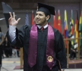 Edder Jaimes, business management, waves to the audience after walking the stage and receiving his diploma at Midwestern State University graduation, May 16, 2015 at the Kay Yeager Coliseum. Photo by Rachel Johnson