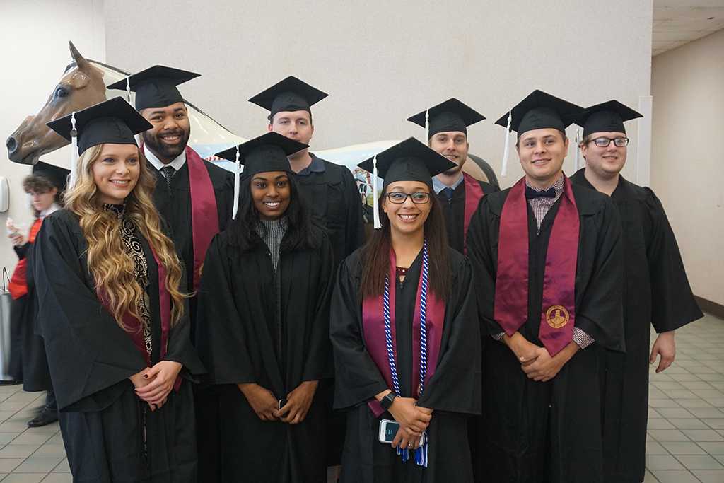 Mass communication students gather for a photo at the Midwestern State University graduation Dec. 17, 2016. Photo by Brendan Wynne