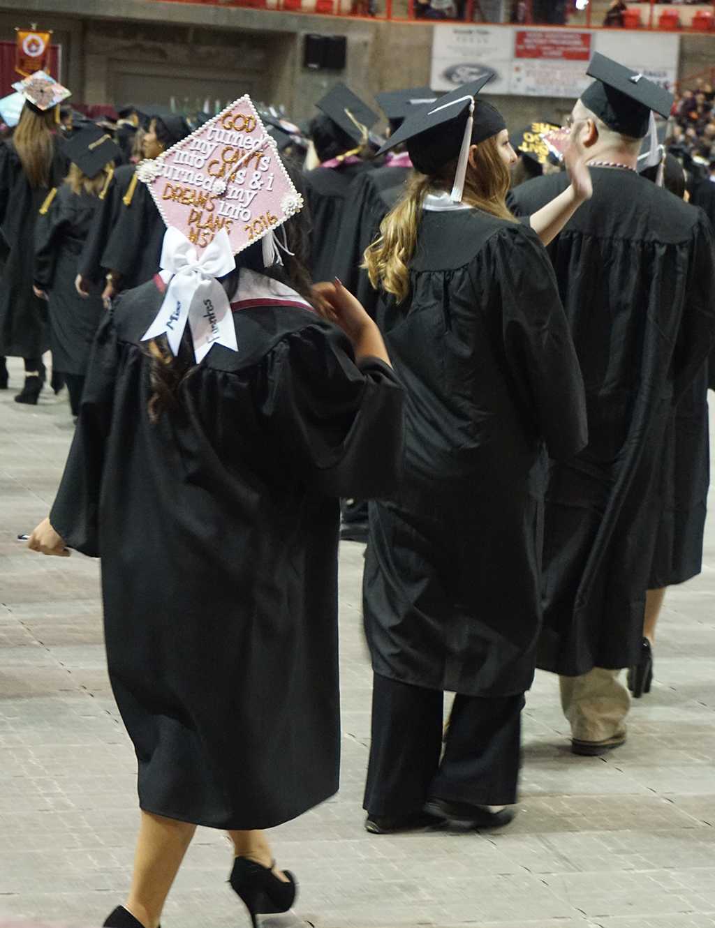Graduates file into the coliseum to take their seats at the Midwestern State University graduation Dec. 17, 2016. Photo by Brendan Wynne